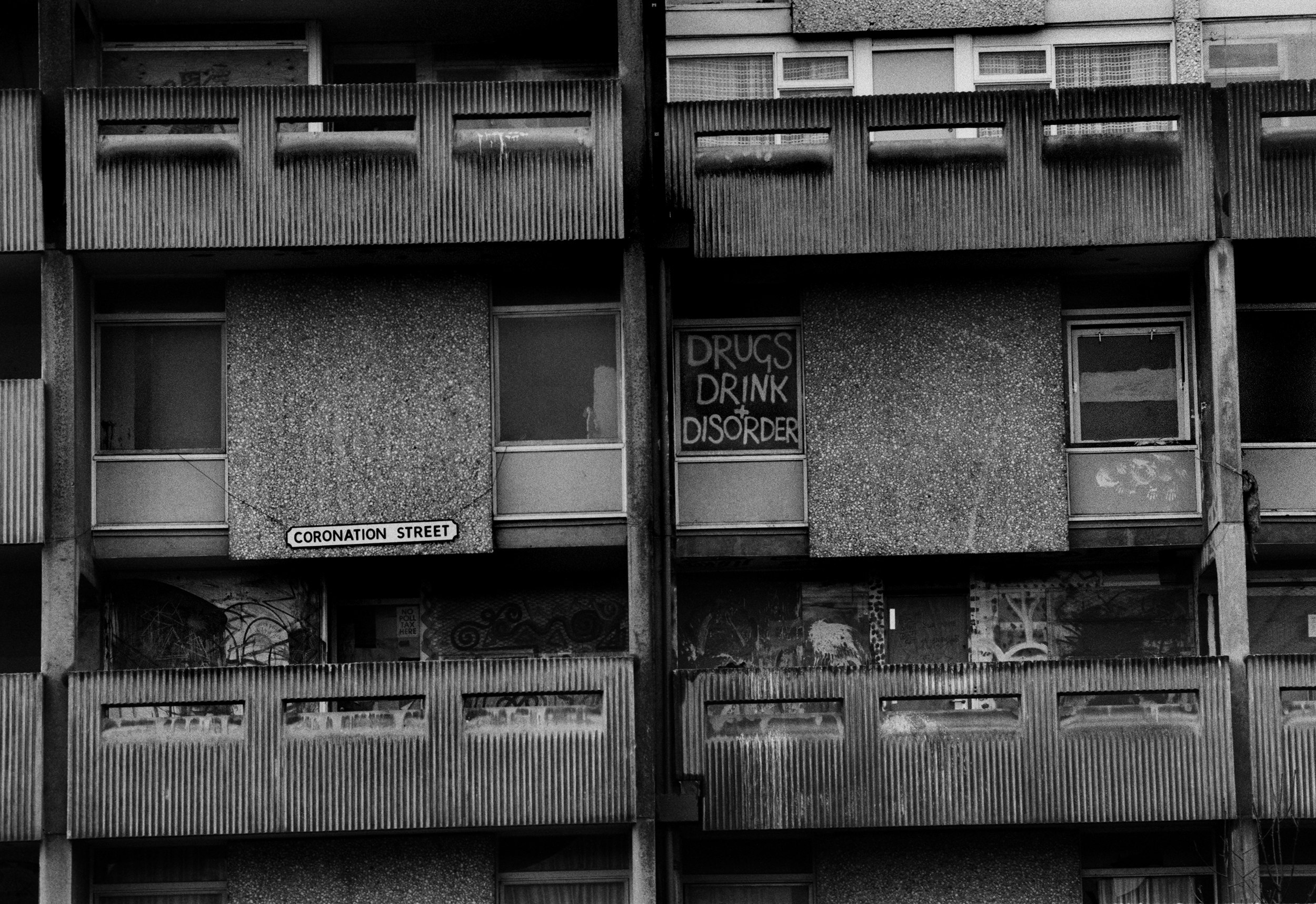 The notorious high-density council housing, built in the 1960s, at Hulme Crescents in southwest Manchester, 1987. The area quickly became blighted by drug and gun crime, leading people to call the city “Gunchester.” A decade on from the original post-punk movement, and the area was still unimproved. Photo by Tom Stoddart/Getty Images.